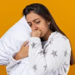 Indian-woman-lying-in-bed-awake,-looking-tired