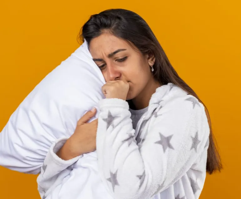 Indian-woman-lying-in-bed-awake,-looking-tired