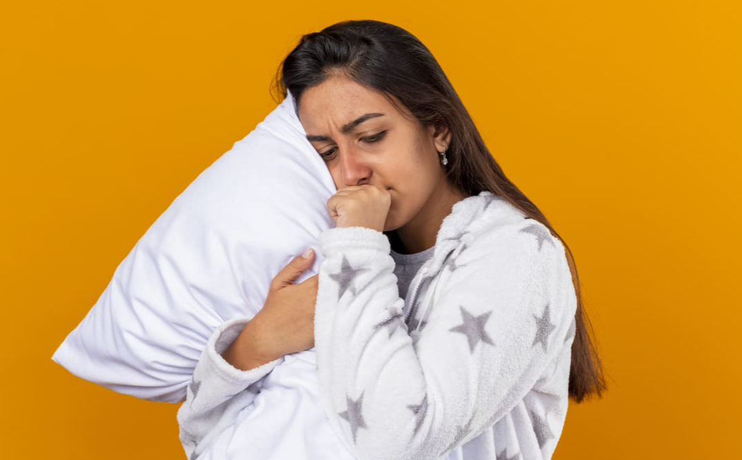 Indian-woman-lying-in-bed-awake,-looking-tired